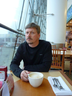 A cup of coffee the size of his head.